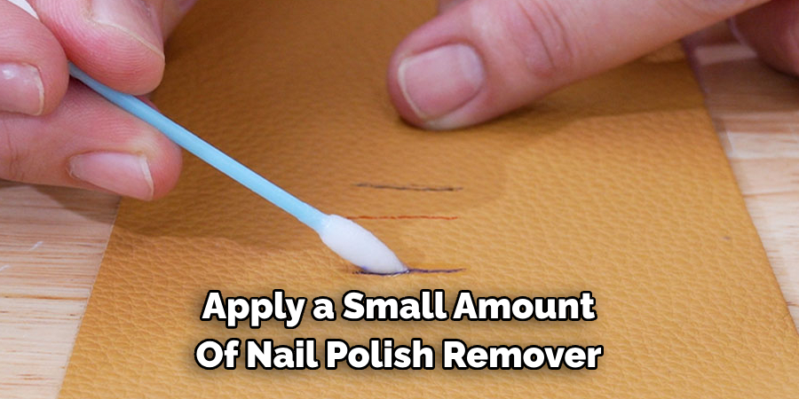 Apply a Small Amount Of Nail Polish Remover