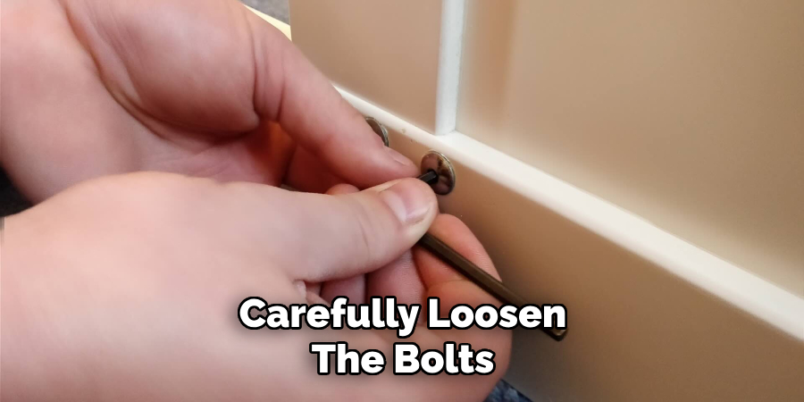 Carefully Loosen the Bolts