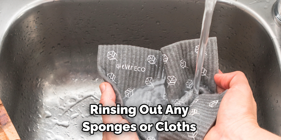 Rinsing Out Any Sponges or Cloths