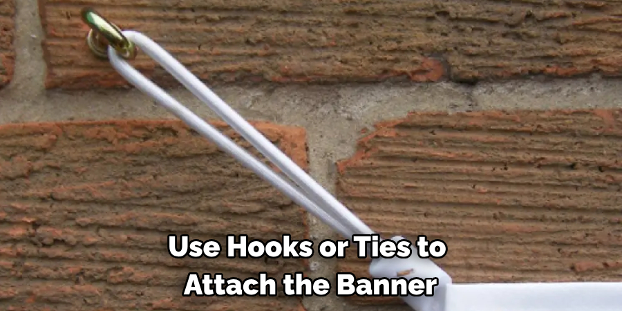 Use Hooks or Ties to Attach the Banner