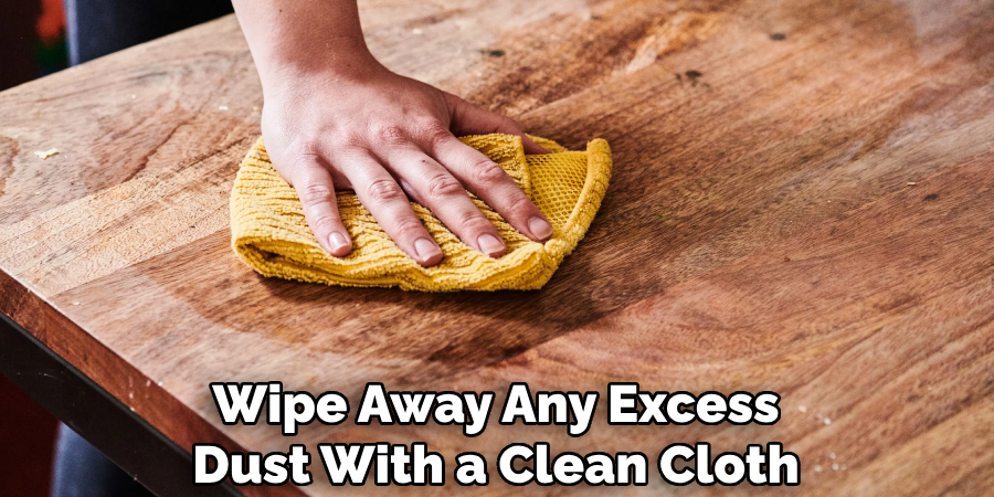 Wipe Away Any Excess Dust With a Clean Cloth