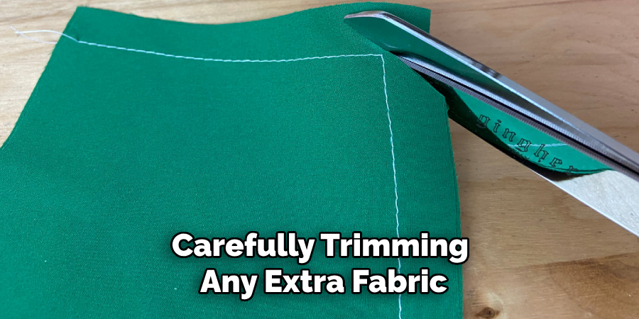 Carefully Trimming Any Extra Fabric