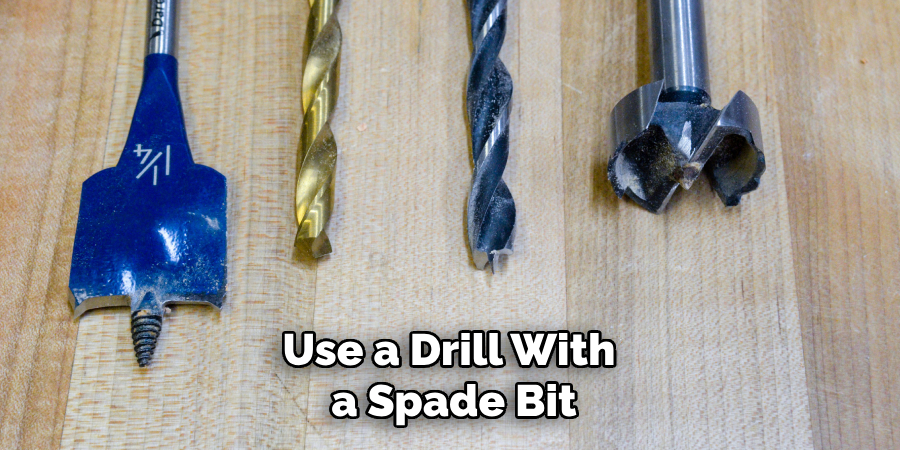 Use a Drill With a Spade Bit