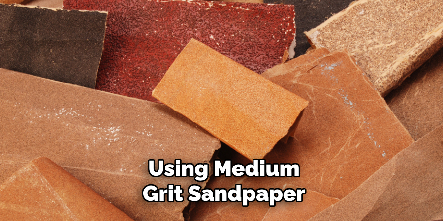 Using Medium-grit Sandpaper