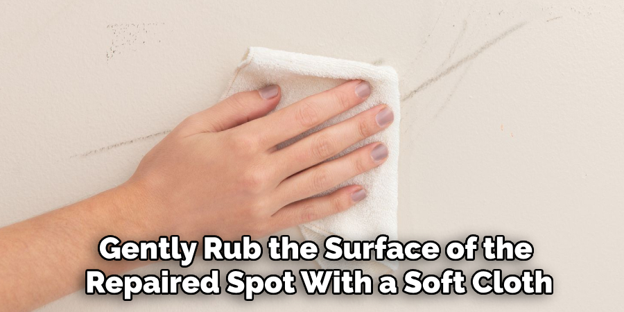 Gently Rub the Surface of the 
Repaired Spot With a Soft Cloth