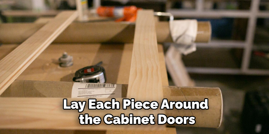 Lay Each Piece Around the Cabinet Doors