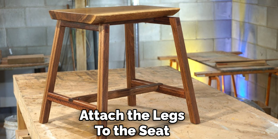 Attach the Legs
To the Seat