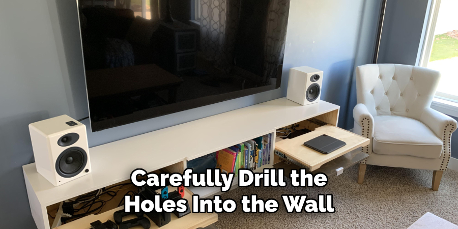 Carefully Drill the Holes Into the Wall