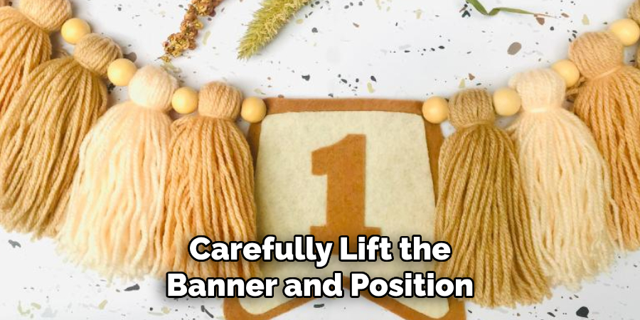 Carefully Lift the Banner and Position