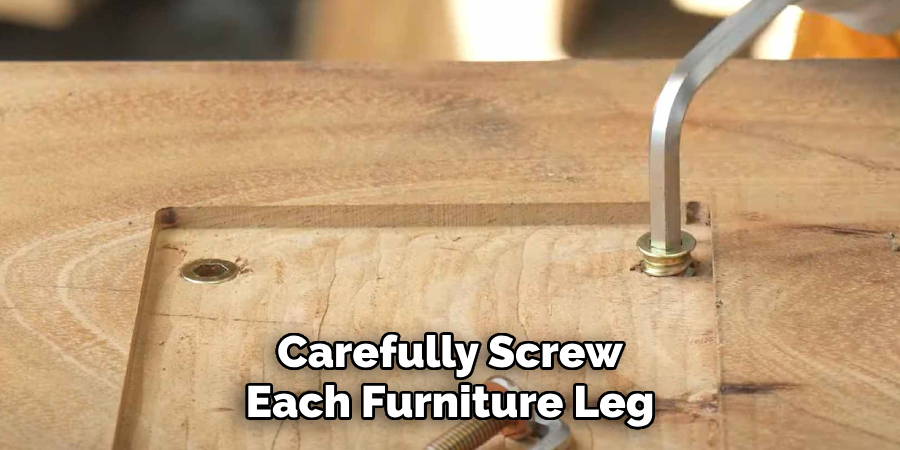 Carefully Screw Each Furniture Leg