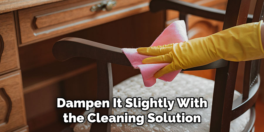 Dampen It Slightly With the Cleaning Solution