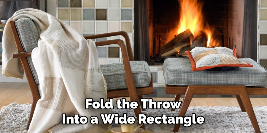 Fold the Throw Into a Wide Rectangle