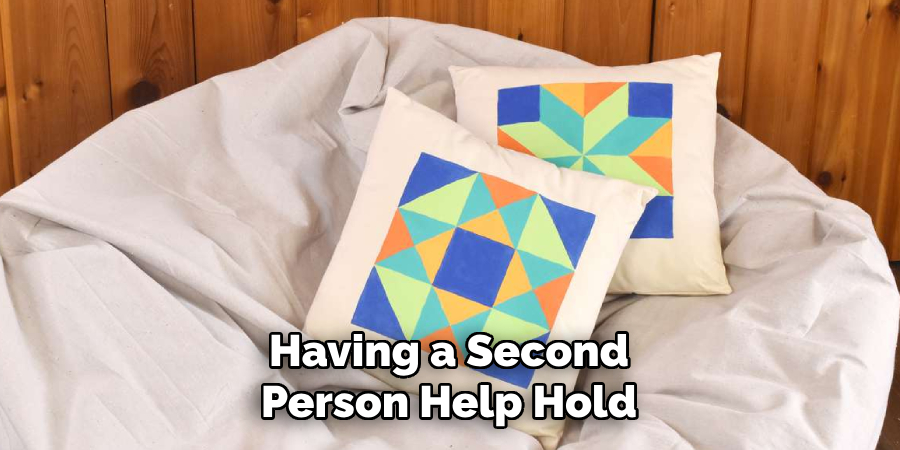 Having a Second Person Help Hold