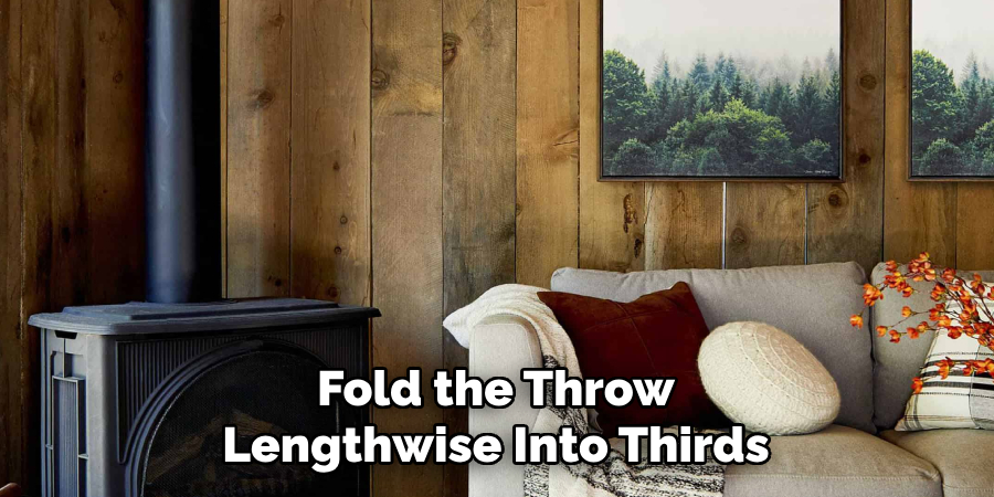 Fold the Throw Lengthwise Into Thirds