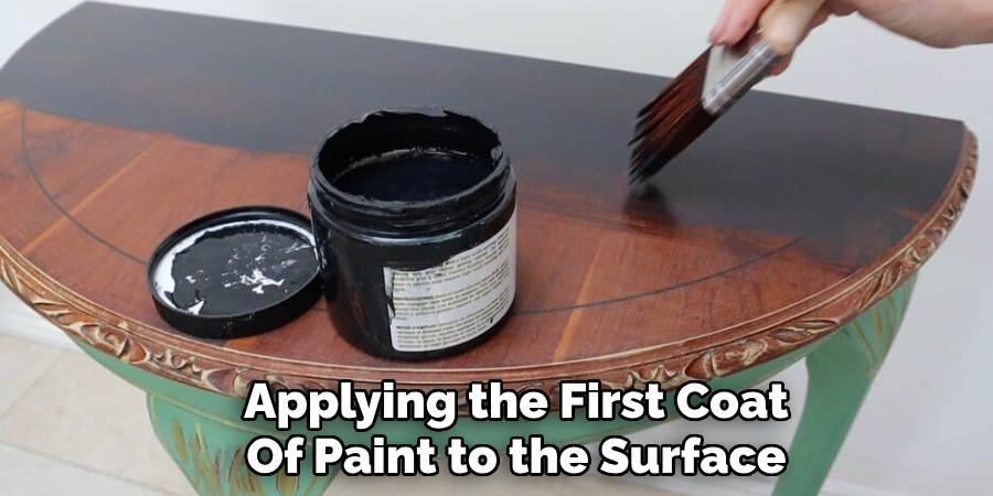 Applying the First Coat
Of Paint to the Surface
