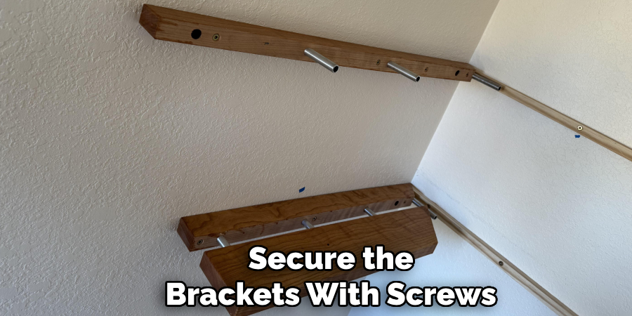 Secure the
Brackets With Screws