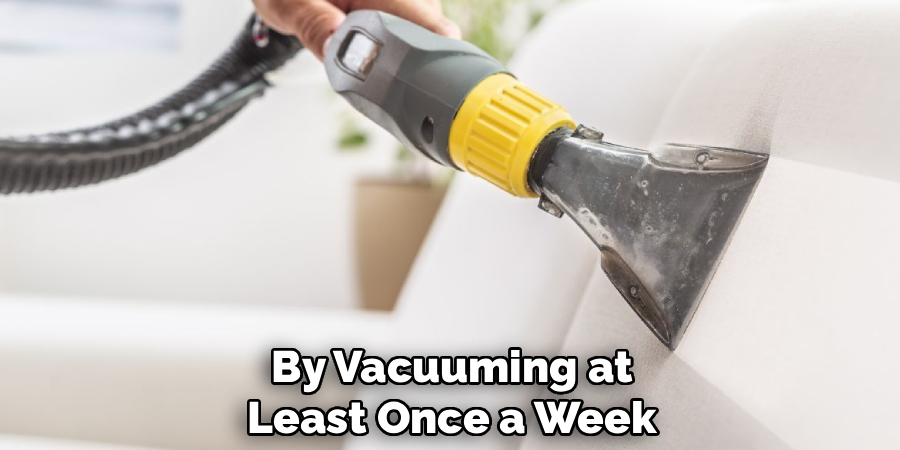 By Vacuuming at
Least Once a Week