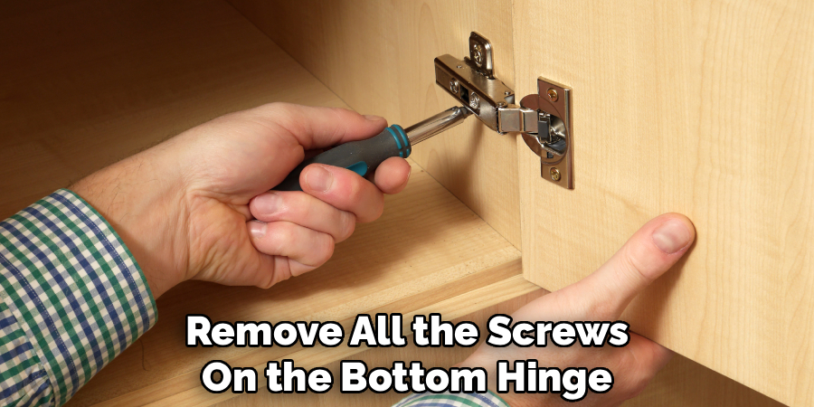 Remove All the Screws
On the Bottom Hinge